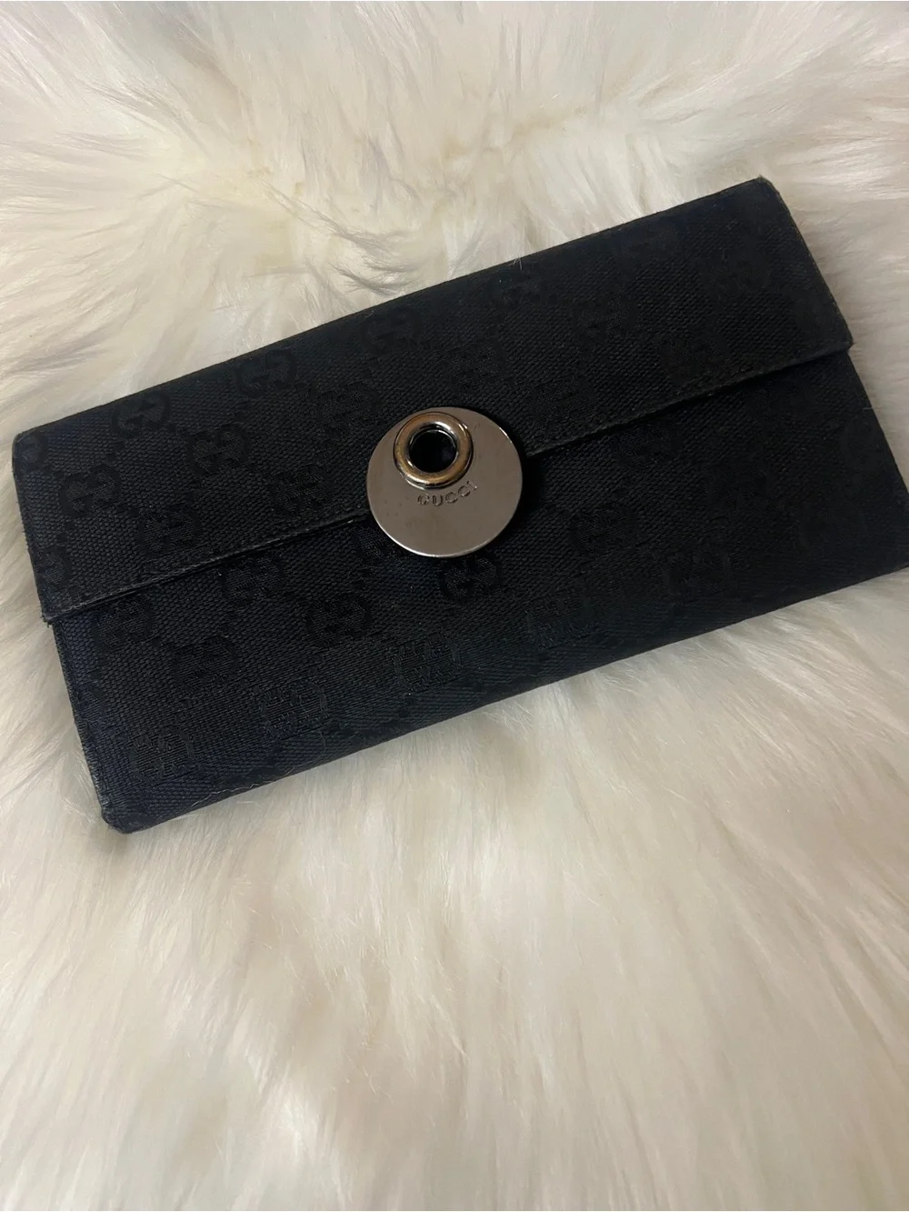 Gucci embossed wallet canvas